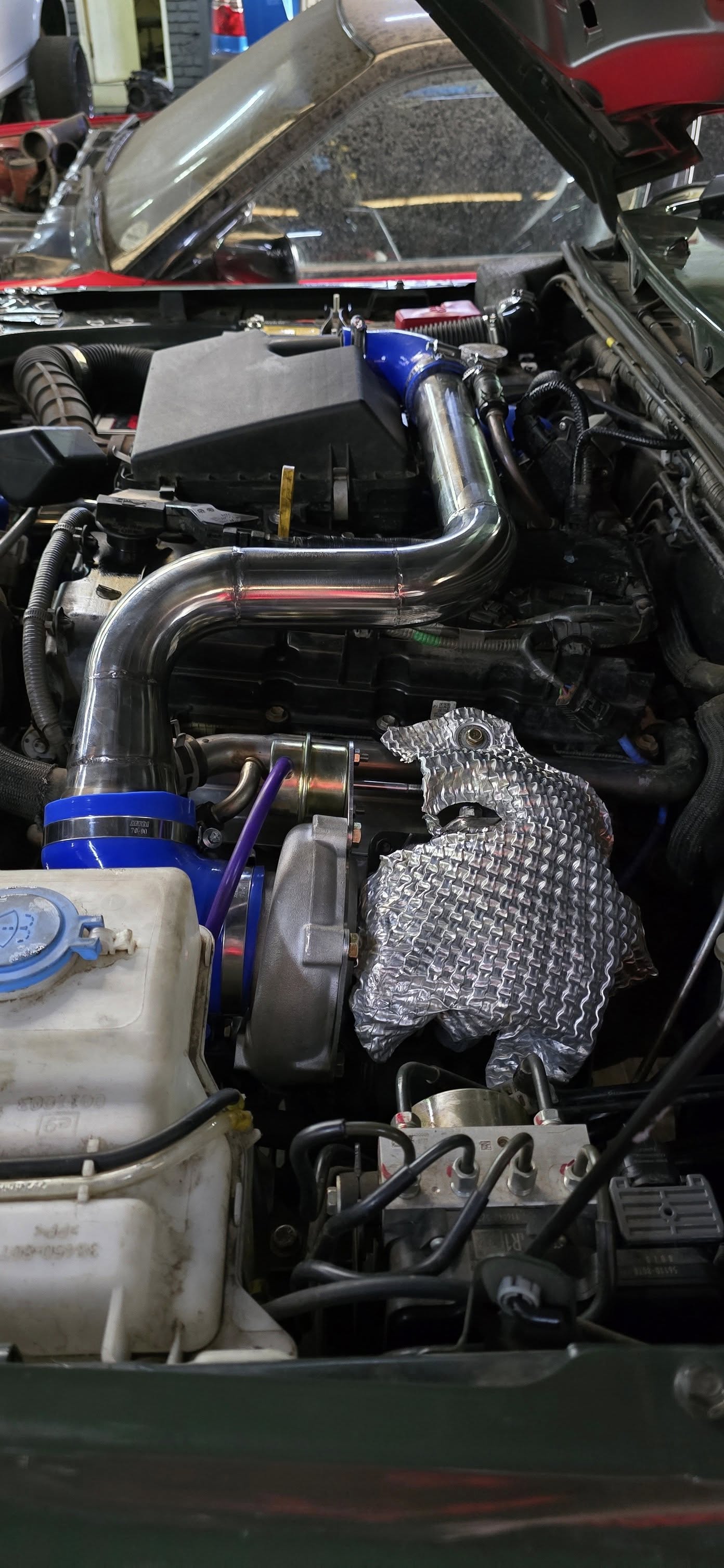 Turbo installation on red vehicle